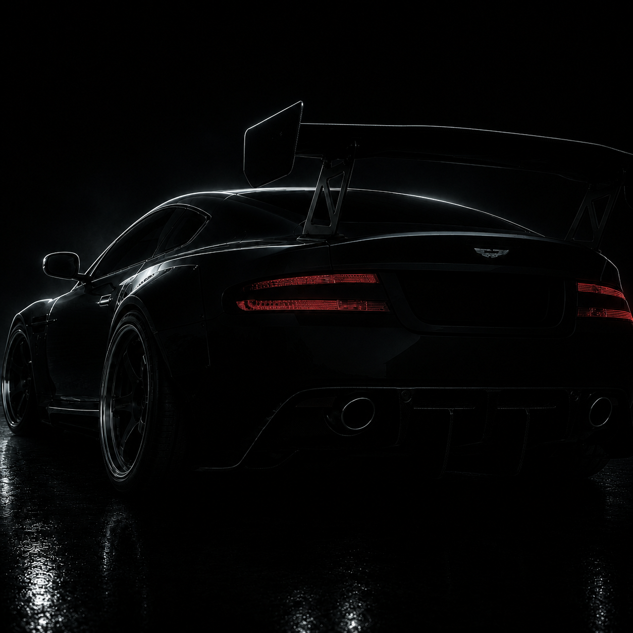 Dark rear three-quarter concept view of Project DBR9, with a large rear wing